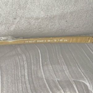 Tory Burch sunglasses with brown lenses gold metal rim and blue rubber pieces